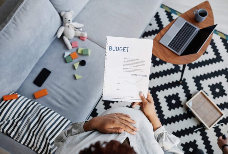 a woman creates a budgeting spreadsheet as she learns how to create a budget.