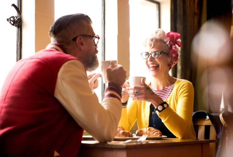 older couple on first date drinking coffee