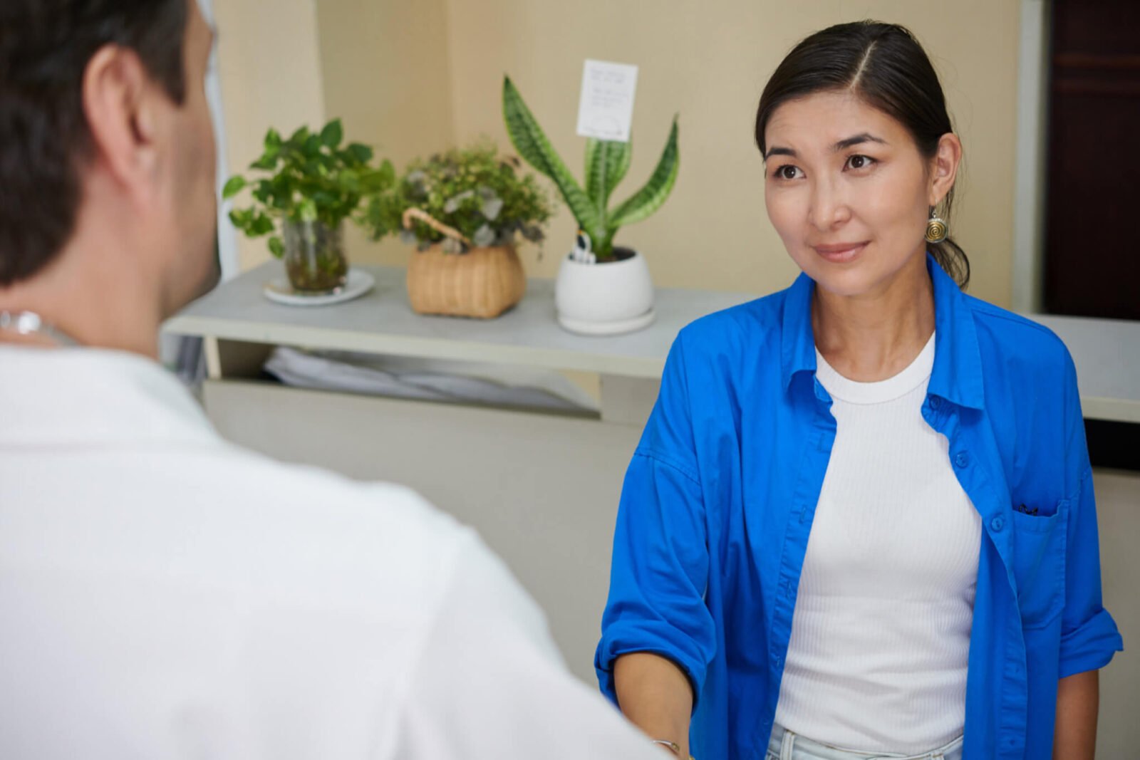 woman at doctor's office having a conversation about menopause symptoms