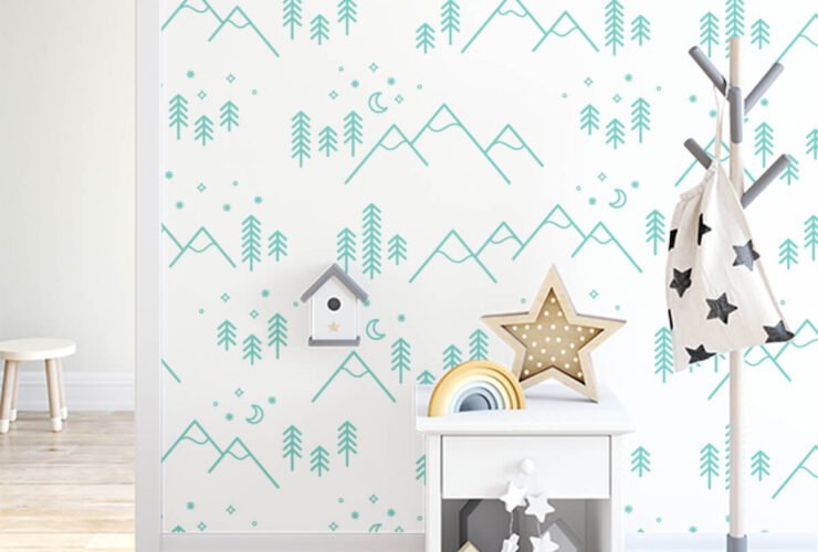 kids room with a coatrack, birdhouse, bedside table and star decorations. Wallpaper features a mountain scene with stars hanging overhead