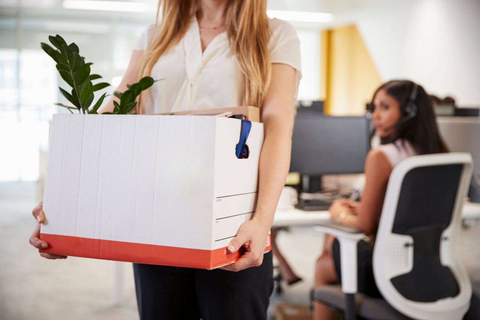laid off employee leaving with box of belongings