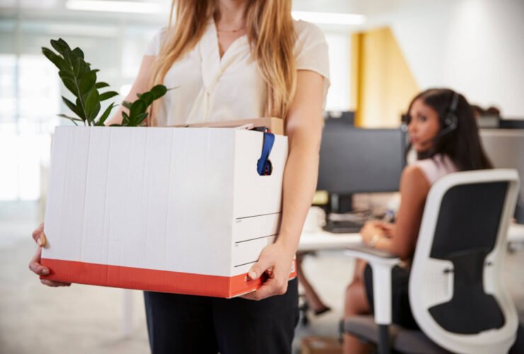 laid off employee leaving with box of belongings