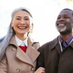 retired couple dressed up and smiling