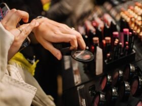 This is a close up of a woman shopping for makeup and testing it on her hand.