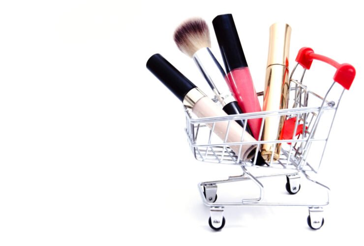 This is an image of a small shopping cart, filled with beauty products.