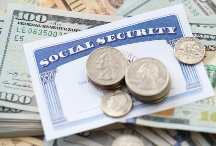 social security card with change on top