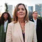 confident female leader standing outdoors