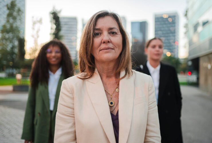 confident female leader standing outdoors