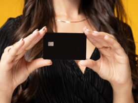 woman holding up a credit card