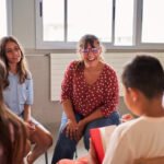 school counselor laughing with students