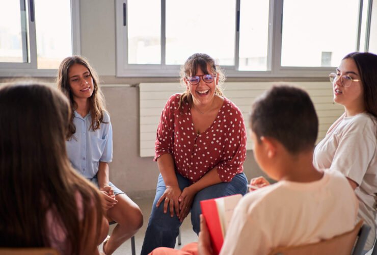 school counselor laughing with students